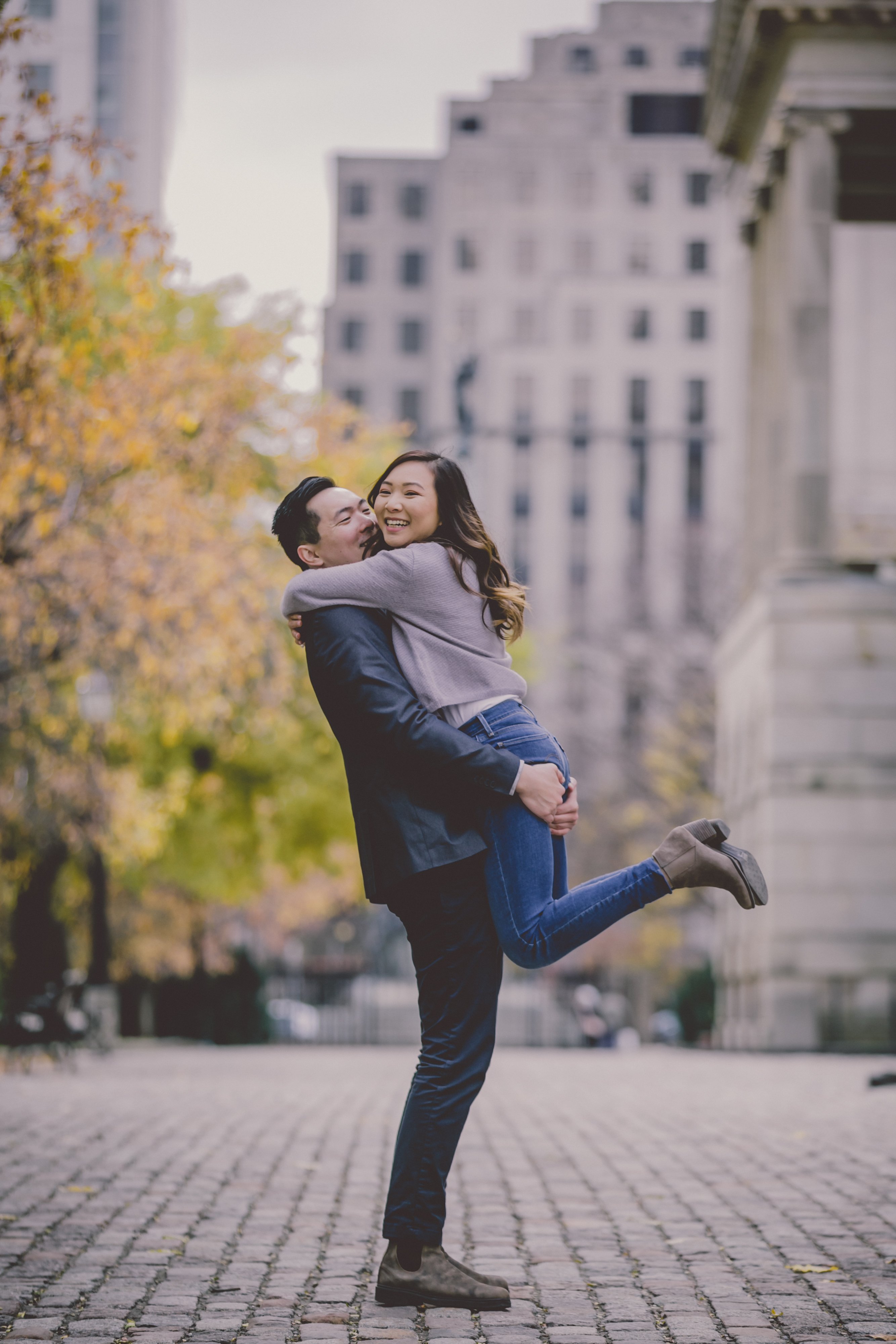Romantic engaged couple, engaged couples Toronto, romance at Osgoode Hall, Downtown Toronto nature and architecture, autumn leaves, engagement photo session by Olive Studio Photography