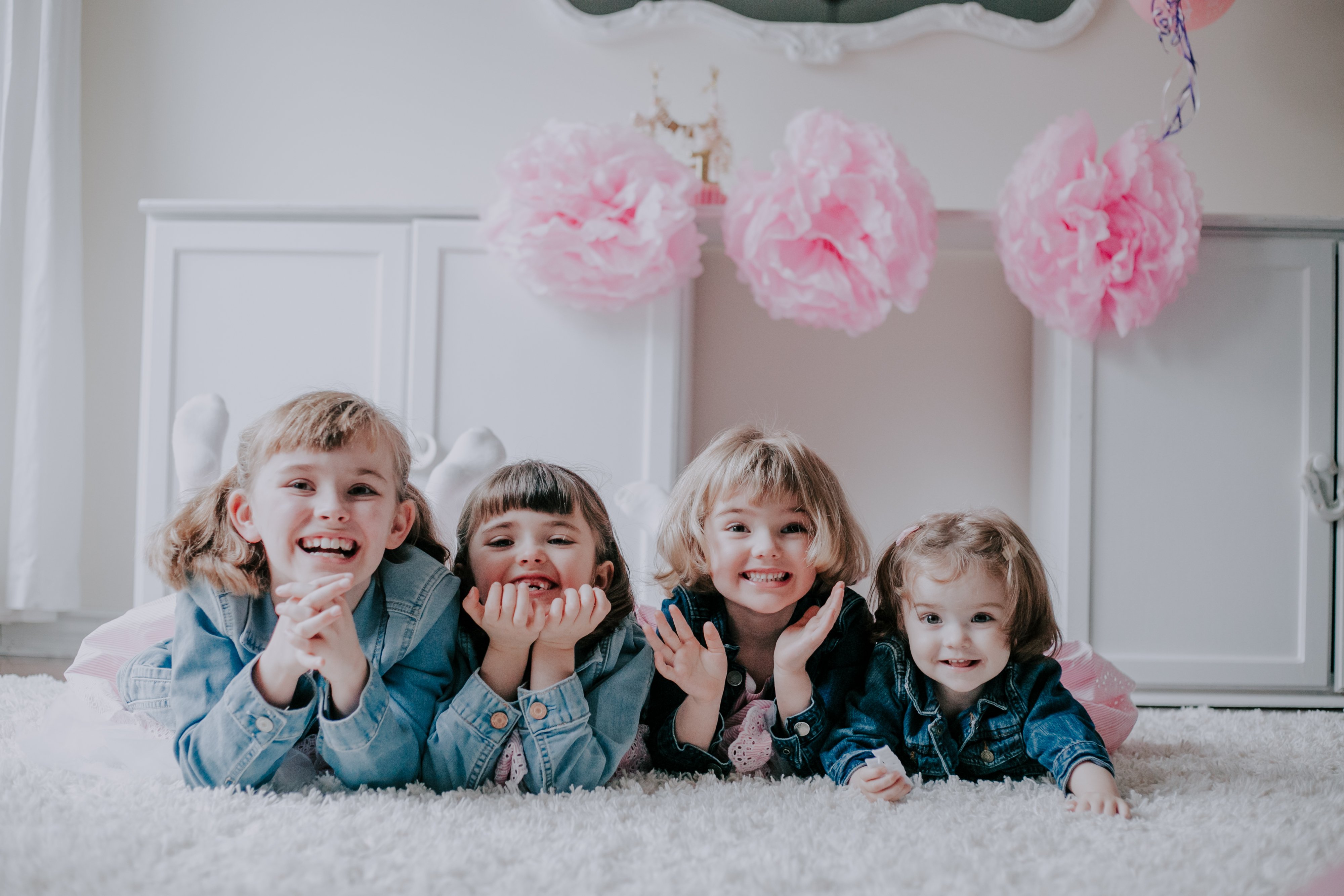 Olive Studio Photography documents a Cake Smash Session in Toronto for a one-year-old and her three older sisters. 