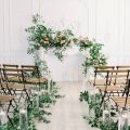 fireplace mantle ceremony backdrop with crawling flowers and foliage