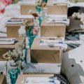 kraft boxes with picnic lunch on picnic tables
