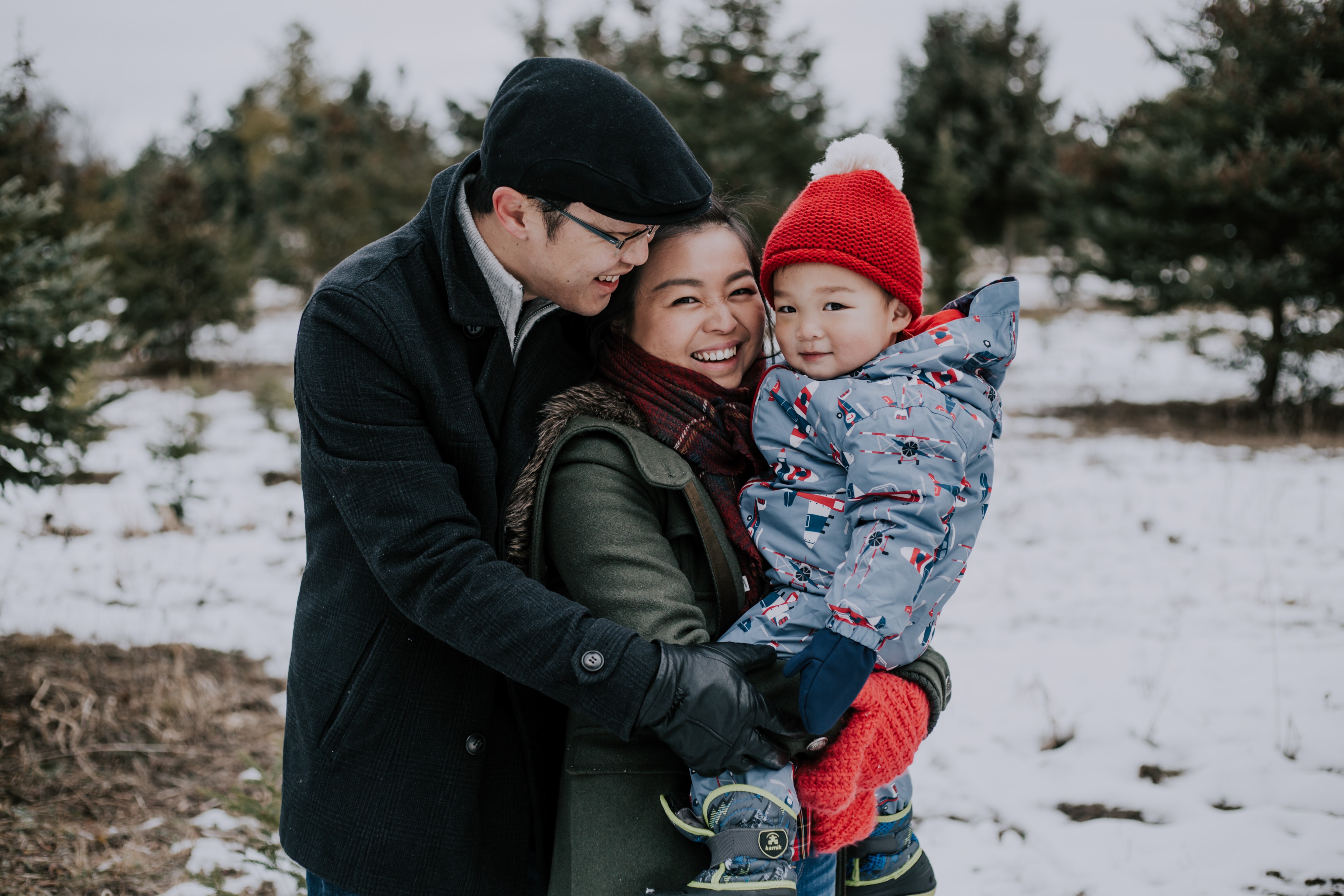 a young asian couple embrace in the winter 