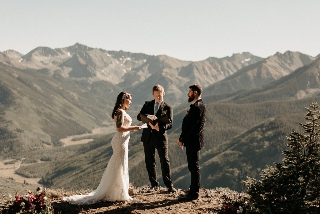 bride and groom elope on top of mountain to say vows