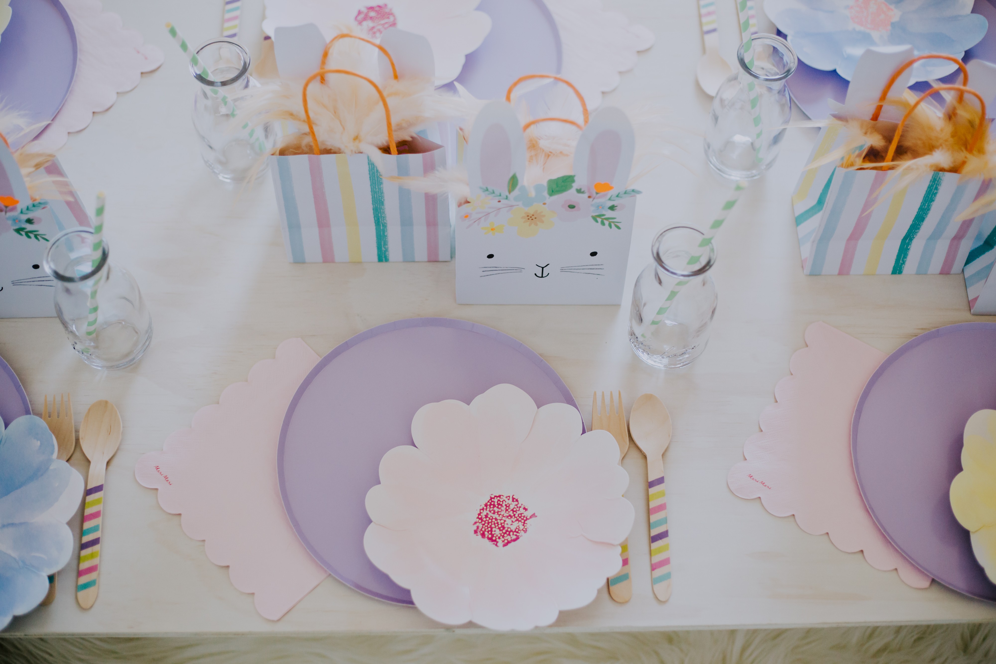 kids table set up with pastel colours in a flower garden themed party