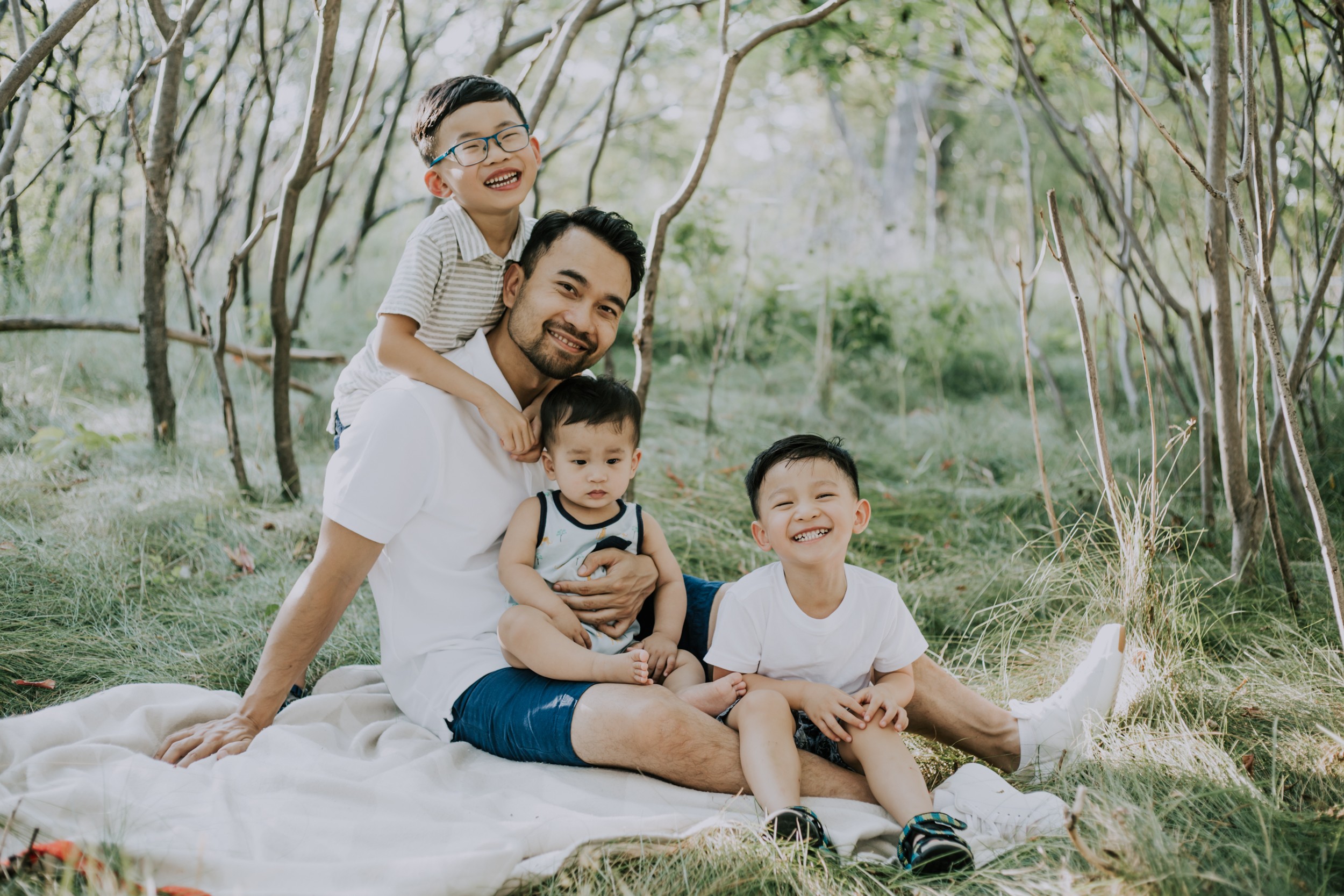 a fathers day mini session of a dad with his three young sons