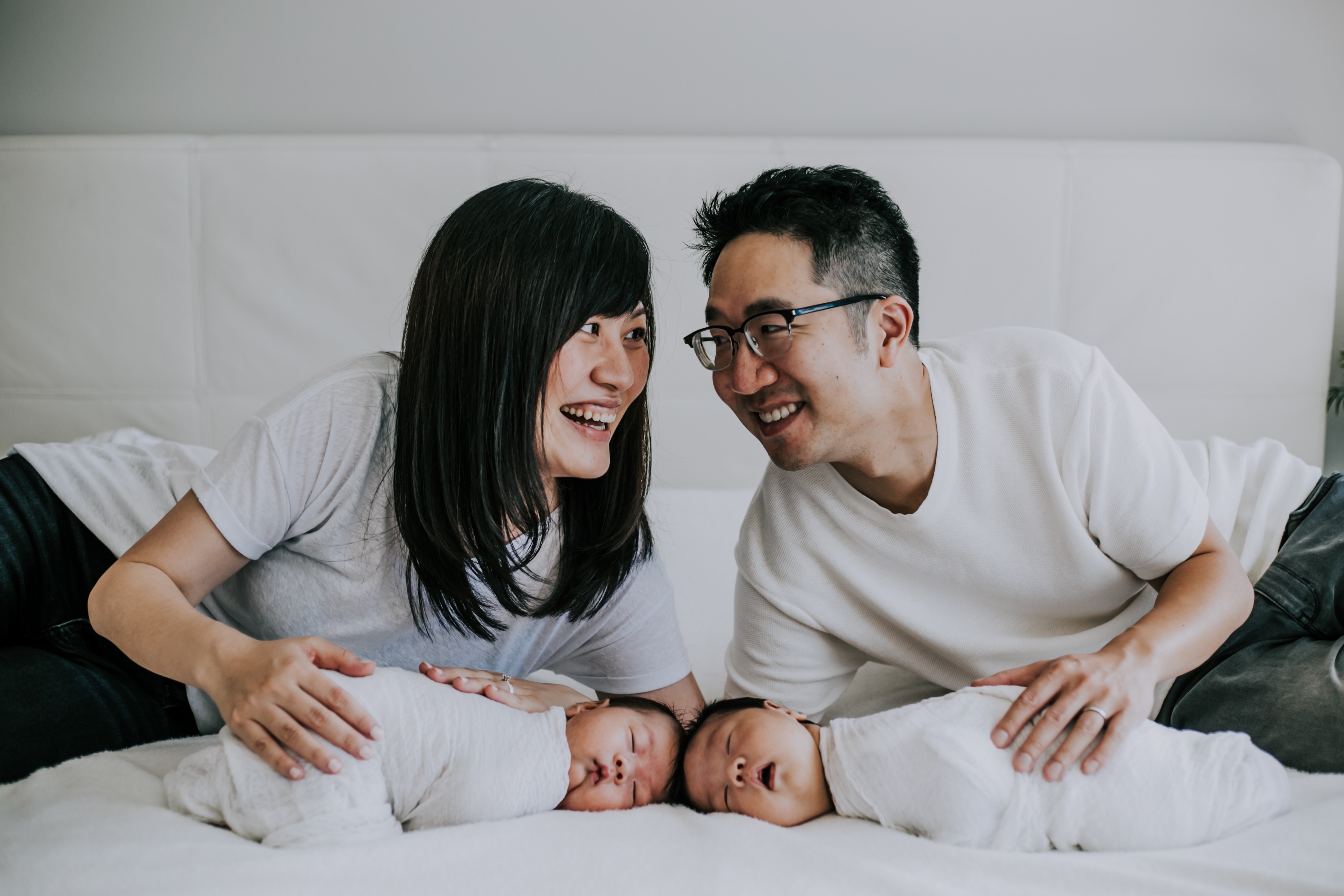 newborn twin boys with mom and dad